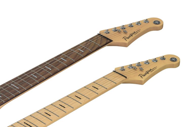 Close-up of Pacifica Professional rosewood and maple fingerboards with headstocks. Grey background.